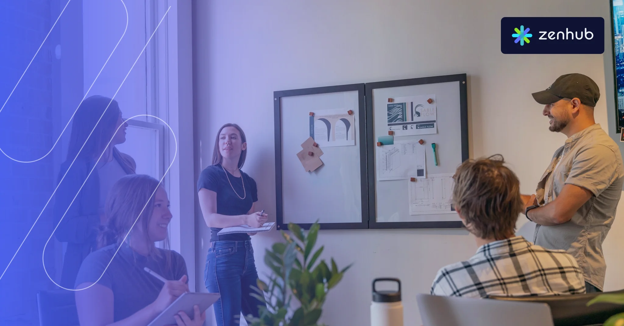A team meeting in a sunlit office, one person leading at a pinboard, with a blue Zenhub gradient